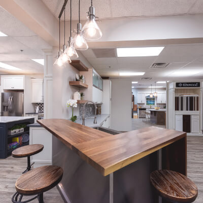 Corner wooden table in showroom kitchen thumbnail